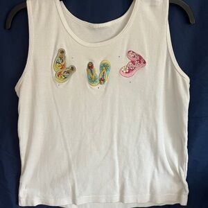 Decorative tank top with three-quarter sleeve over blouse